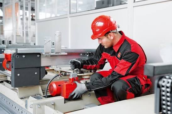 Retrofit services engineer working on building equipment